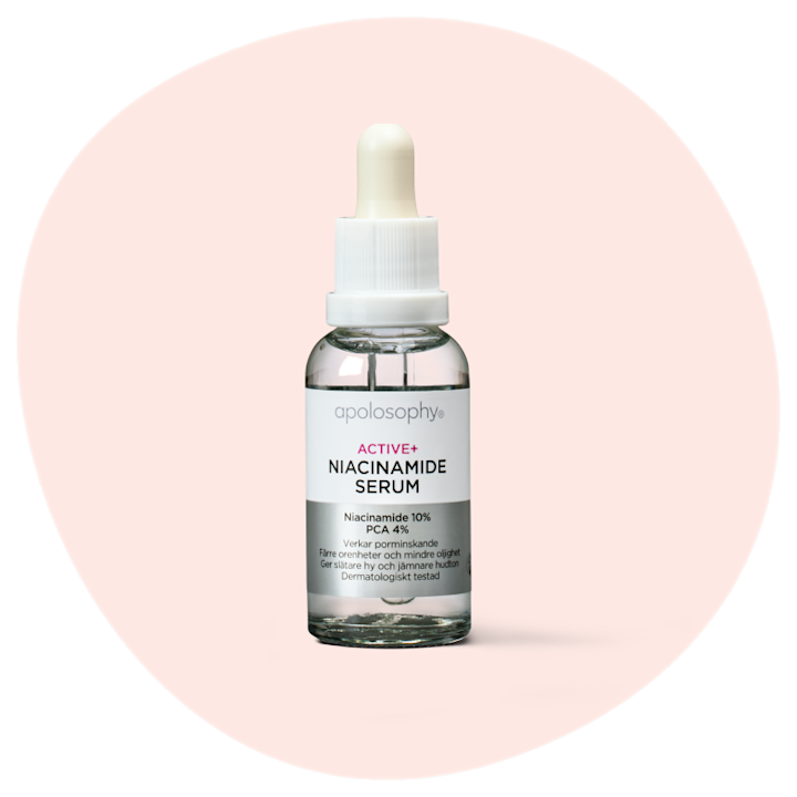 Flaska med apolosophy ACTIVE+ Niacinamide Serum med pipett, placerad mot en ljusrosa bakgrund.