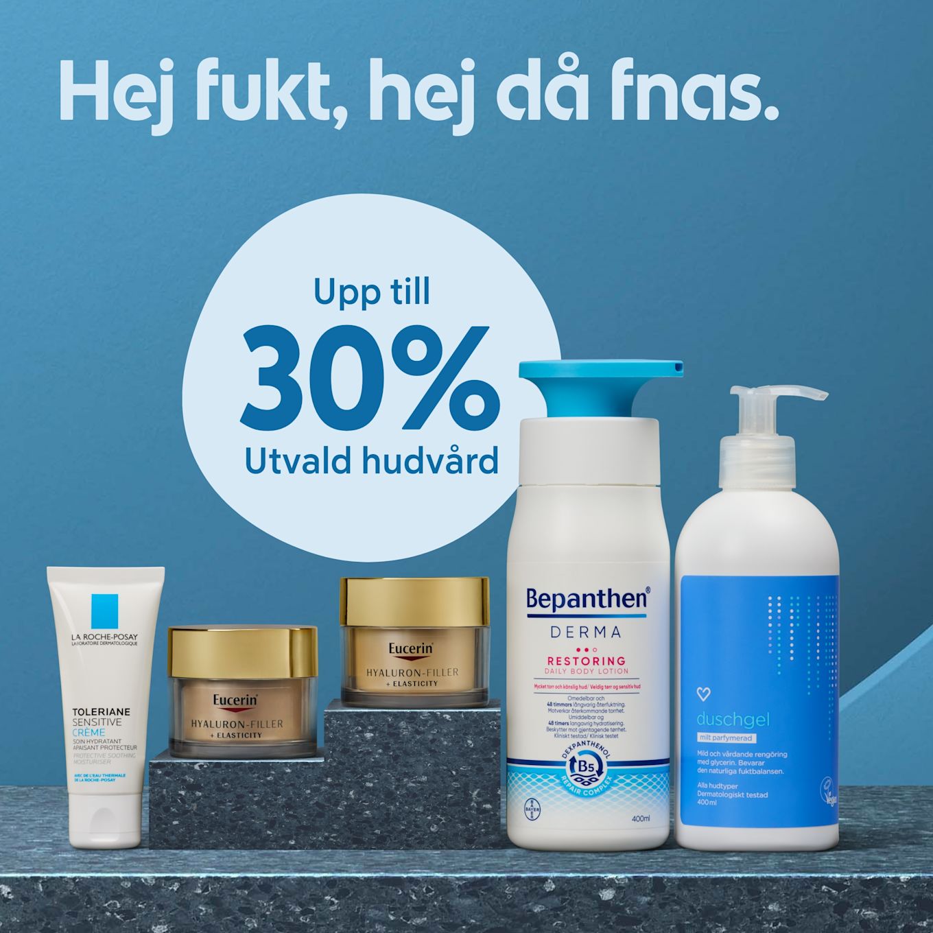 Hudvårdsprodukter från La Roche-Posay, Eucerin, Bepanthen och duschgel på marmorbord med blå bakgrund och text om upp till 30% rabatt.