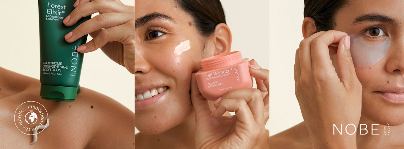 Kvinna applicerar NOBE hudvårdsprodukter: body lotion på axeln, ansiktskräm på kinden och ögonmask under ögat.